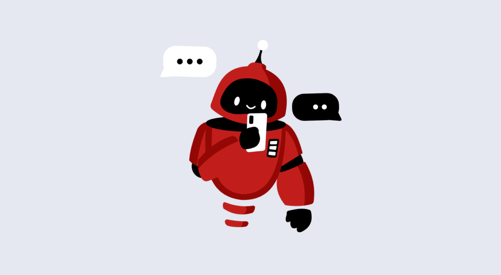 Symbolbild: Ein kleiner Roboter, der am Smartphone chattet